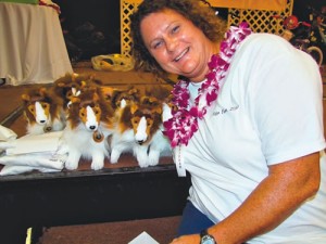 Dr. Heather Hopkins snuggles with a litter of stuffed