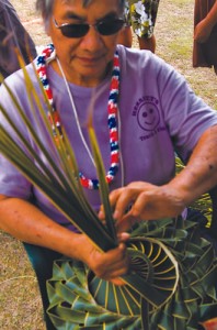 Evelyn Olores demonstrates palm weaving