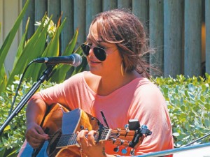 Iris Downey sings at open mic by the pool