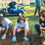 Waimea Canyon Middle students and Michele Saito get down and dirty
