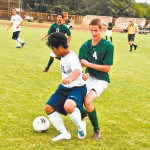 Justin Molina (15) shields the ball from Calvin Rux