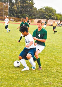 Justin Molina (15) shields the ball from Calvin Rux