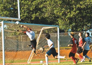 KHS goalie Dylan Snyderâ€™s acrobatic leap just misses a penalty kick from Caleb Licke in the first half