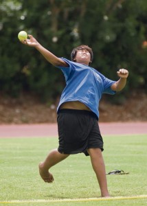 Kelly Ragasa of Waimea Canyon School launches a softball