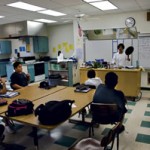 Kay Holt discusses a recipe with Holomua students at Kapa‘a Middle School