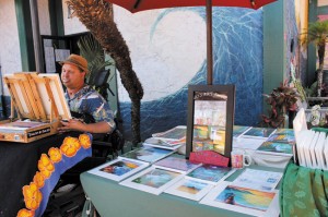 Moses Hamilton sets up his booth at Ching Young Village. Coco Zickos photo